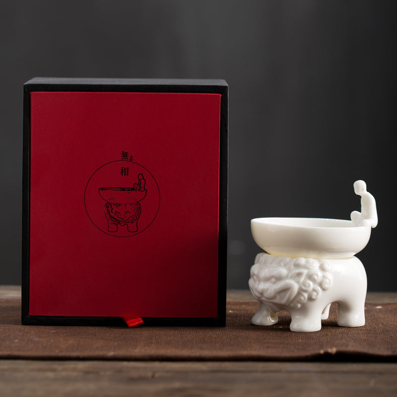 tea infuser with buddha and legendary beast